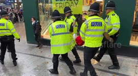 Police arrest 'Santa' and drag him through busy city centre