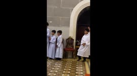 Wholesome choir boys cheer as bride and groom have first kiss