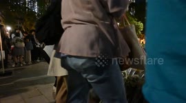 Locals lay flowers in tribute of 151 killed in Hong Kong fire tragedy