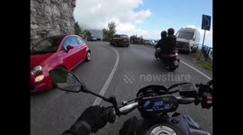 Motorcycle Overtakes Midturn and Loses Control