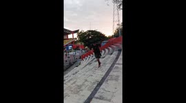 Man tumbles down stadium stairs during exercise in Padang, Indonesia