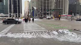Snow buildup creates slippery pedestrian hazards in Chicago, Illinois, USA