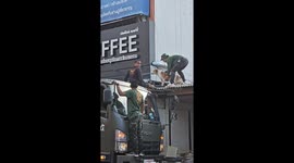 Soldiers rescue dog stranded on roof during floods in Thailand