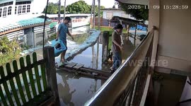 Makeshift bridge breaks sending husband falling into floodwater