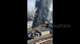 Truck carrying liquid paraffin catches fire, setting road alight in China