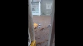 Dramatic footage shows yellow taxi being swept away by strong floodwaters in Colombia