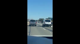 Girl Spotted Kicking at Van on Freeway