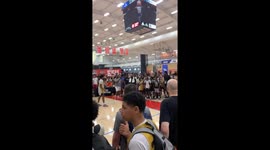 Young spectator takes basketball to the head after player's powerful slam dunk