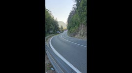Rally car executes perfect drift around sharp bend in Bosnia