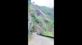 Motorists retreat as landslide crash down mountain