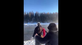 Failed playful kick attempt on snowy lake in Xinjiang, China