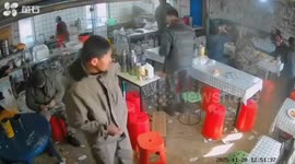 Cow crashes into ramshackle noodle eatery and sends boiling water flying off stove