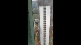 Crane Operator Saves Worker Trapped on Burning Building's Roof