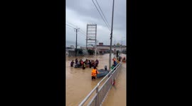 Baby rescued from flood in southern Thailand