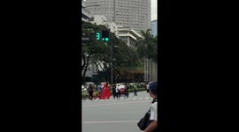 Beauty queen and entourage run through traffic as she misses parade