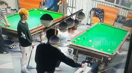 Youngster hit in face while trying to distract friend from potting ball