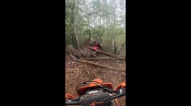 Motorcycle Rider Wipes Out on Trail
