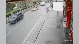 Bungling motorist hits biker who stopped to give way to ambulance