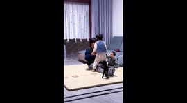 Adorable dog joins in family play in Hebei, China