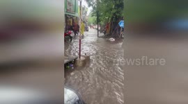 Flash flood submerges street in India during storm