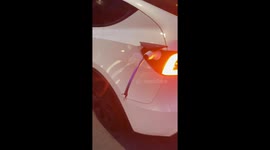 Oblivious Tesla driver drags severed charging cable down Stockholm street