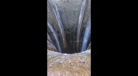 Boater floats dangerously close to massive lake spillway in nerve-wracking clip