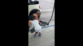Grandpa pranks dancing toddler with air hose at car wash in Texas