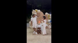 Couple celebrates joyously as blue smoke reveals they are expecting a baby boy