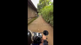 Dog chases three friends during unexpected neighborhood ride in Java, Indonesia