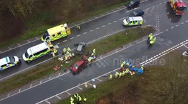 Police fire and ambulance workers attend a 2 car collision on the A12 at the junction of the B1119 Rendham Road Suffolk  Video shows one of the victims being transferred to a waiting ambulance