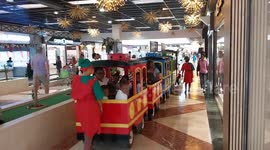 Christmas train transporting happy children. French island of Martinique, La Galleria Commercial Center, Le Lamentin, Caribbean, West Indies, France, 4 December 2025. Caribbean,