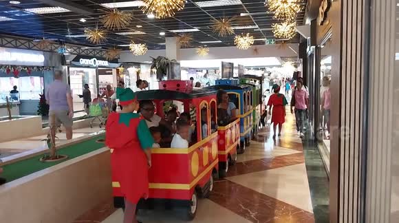 Christmas train transporting happy children. French island of Martinique, La Galleria Commercial Center, Le Lamentin, Caribbean, West Indies, France, 4 December 2025. Caribbean,
