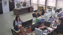 Staff extinguish fire after charging phone explodes