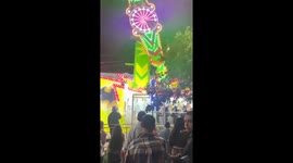 Mariachi Band Plays On Amusement Park Ride