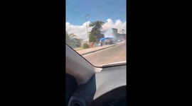 Moment illegal fireworks stall on street corner explodes after catching fire