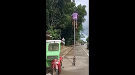 Impressive moment man rides unicycle on road