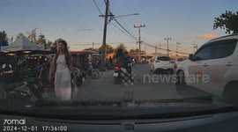 Overloaded motorcycle taxi carrying tourists topples backwards