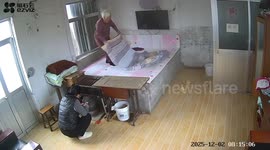 Elderly woman falls off bed but is caught by family member in right place at right time