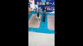 Woman lifted on trampoline in playful moment in Jilin, China