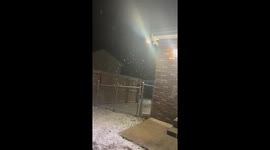 Continuous snowfall blankets neighborhood in Clarksville, USA
