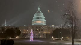 Christmas tree glows amid steady snowfall in Washington, D.C., USA