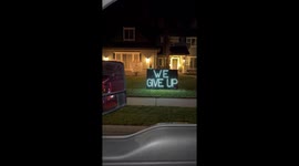The folks next door to the Candy Cane lane house here in Eagle Idaho threw up their hands and said “WE GUVE UP” 