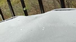 Heavy sleet pellets fall during a wintry shower in Ferndale, Arkansas, USA