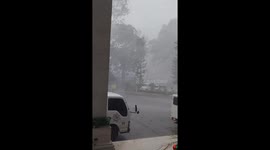 Street vendors flee as Tropical Depression Wilma hits the Philippines