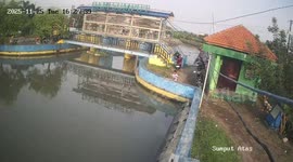 Child rescued from water at Di Pintu Air Sumput, Sidoarjo, Indonesia