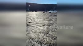 Scientists descend into Kilauea volcano crater to collect samples