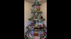 Is this the world's best decorated Christmas tree? Trains, lights, and Ferris wheel adorn tree