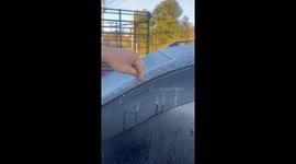 Driver finds her car covered in ice during cold spell in Thailand