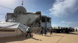 Palestinians perform Friday pray on rubble of destroyed mosque in Khan Younis