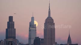 Cold moon supermoon rises over New York skyline